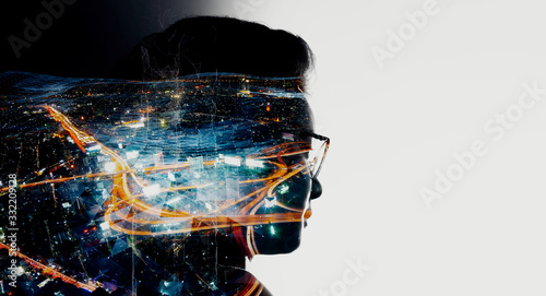 Double exposure of Asian woman silhouette and modern renewable city skyline background.Energy Digitalization concept.