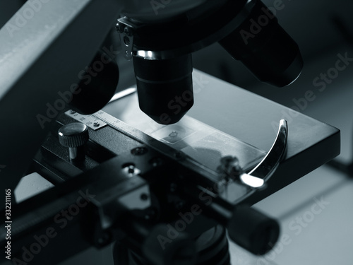sciencie laboratory microscope macro detail monochrome image. photo