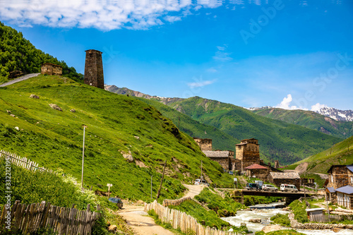 Georgian Village Ushguli with stone defense towers in a valley next to the river in Svaneti region near Mestia in Caucasus mountains in Georgia.