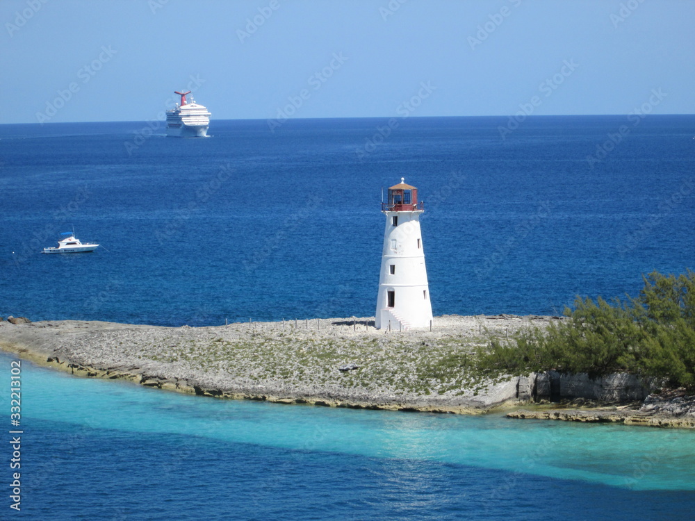 Caribbean lighthouse with cruise ship 