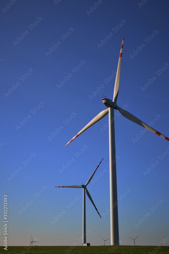 wind turbine against blue sky wind turbine against blue sky