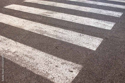 Rome Italy. Pedestrian crossing in an asphalt road. White stripes on the street.