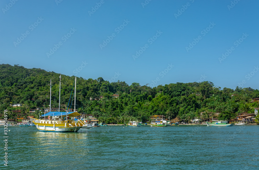 Beautiful landscape with water, boats and blue sky in Paraty, Brazil