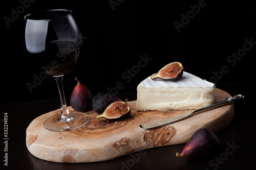 Brie Cheese and Red Wine On Black