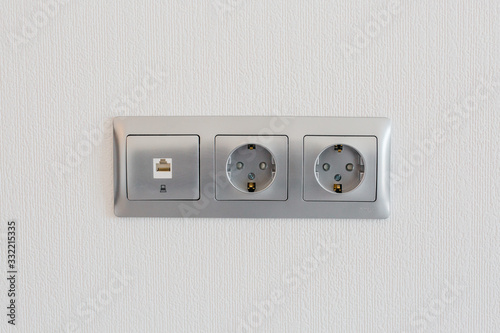 socket on a light wall in a stylish apartment