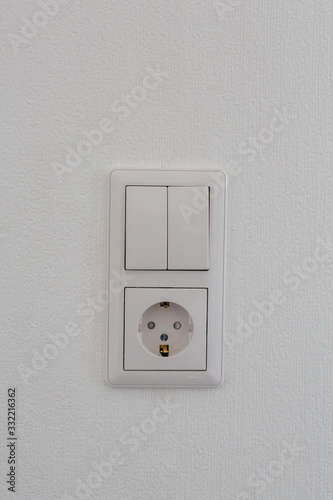 socket on a light wall in a stylish apartment
