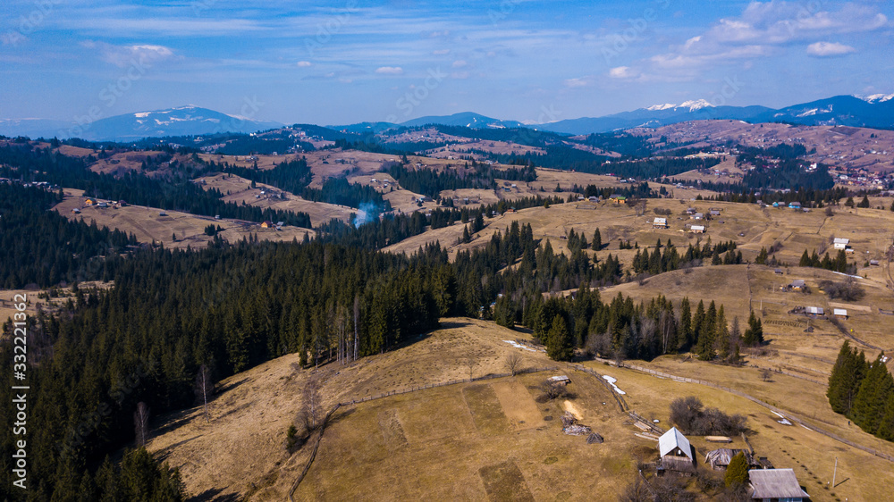 Naklejka premium Alpine village settlement of a house on top of a mountain aerial photo Carpathians Ukraine.