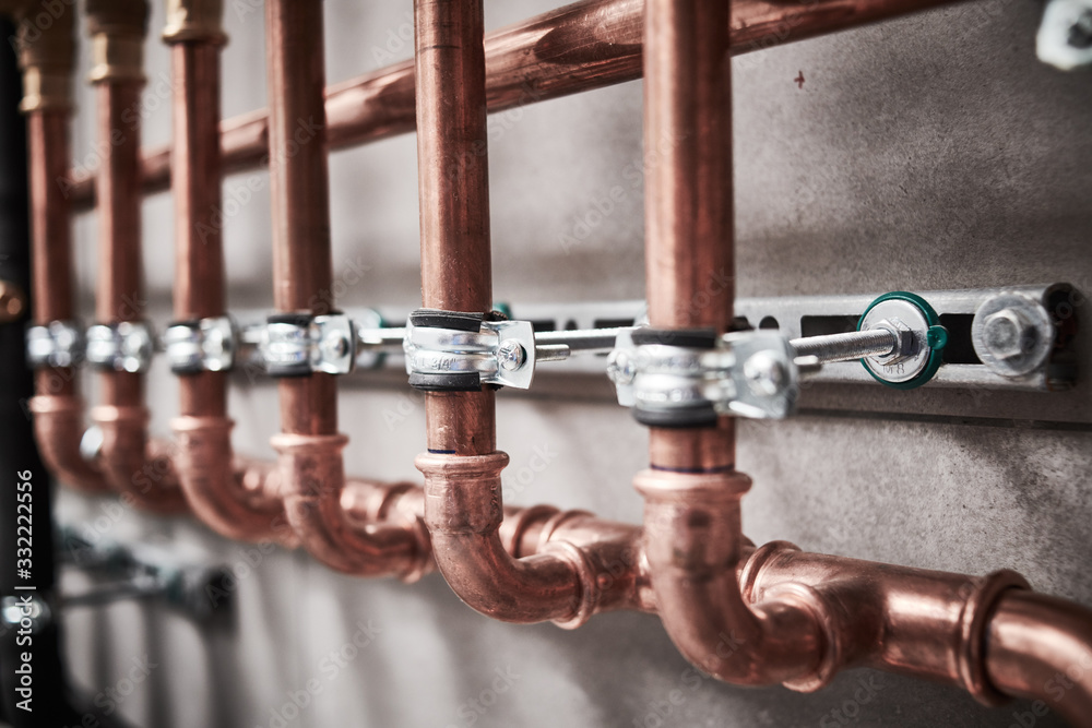 Plumbing service. copper pipeline of a heating system in boiler room - obrazy, fototapety, plakaty 