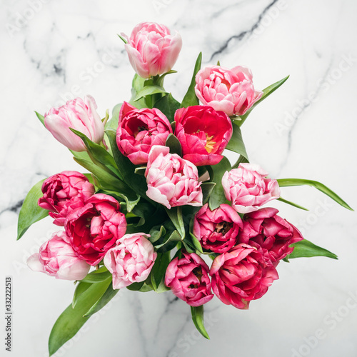 Beautiful Pink Peony Tulips On Marble Background Top View Square Orientation. Mother s Day Bouquet Concept