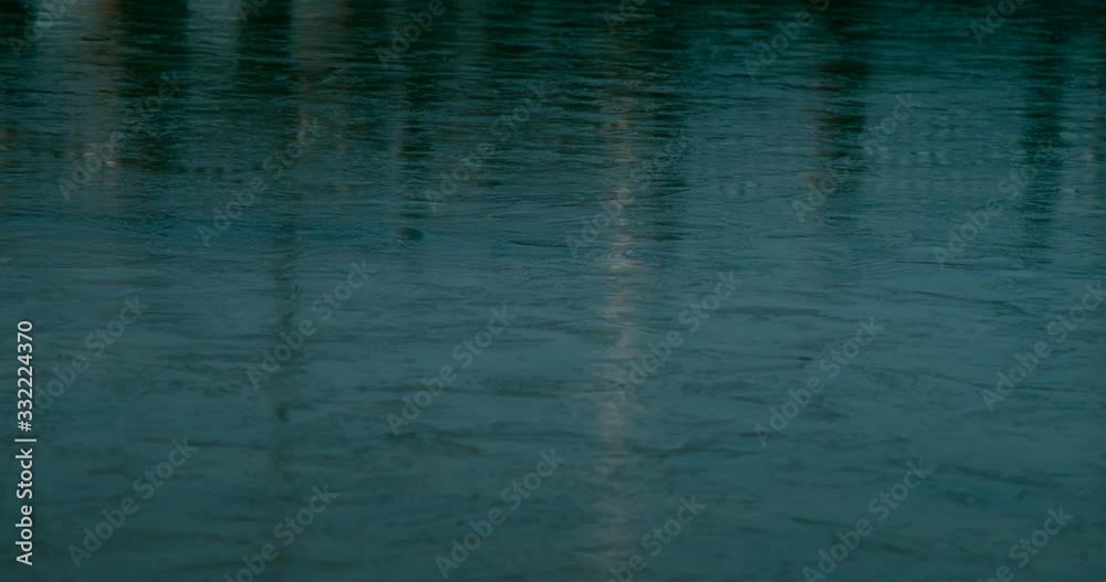 Close up view of a frozen lake shiny surface with a reflection. Close up view of a frozen lake shiny surface with a reflection.