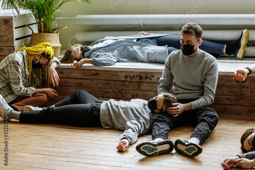 edipemy, covid-19 disease or coronavirus entails poor health, fatal outcome. people with fever heat lie unconscious on the floor in hospital photo