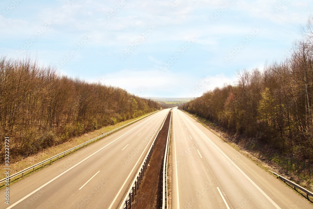 empty road, Highway, german autobahn in March during the at quarantine time because of coronavirus infection Covid-19. corona virus outbreak, quarantine, social isolation. No cars, nobody on the road
