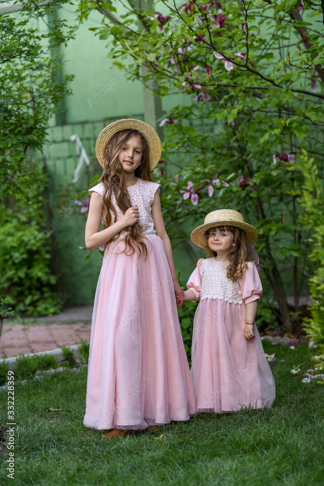 sisters having fun in park. happy sisters sisters having fun in park. happy sisters
