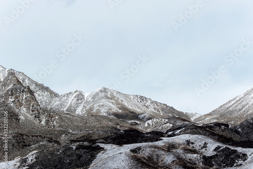 winter landscape of snow mountain with grassland 