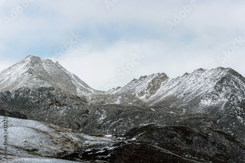 winter landscape of snow mountain with grassland  © cceliaphoto