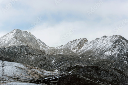 winter landscape of snow mountain with grassland 