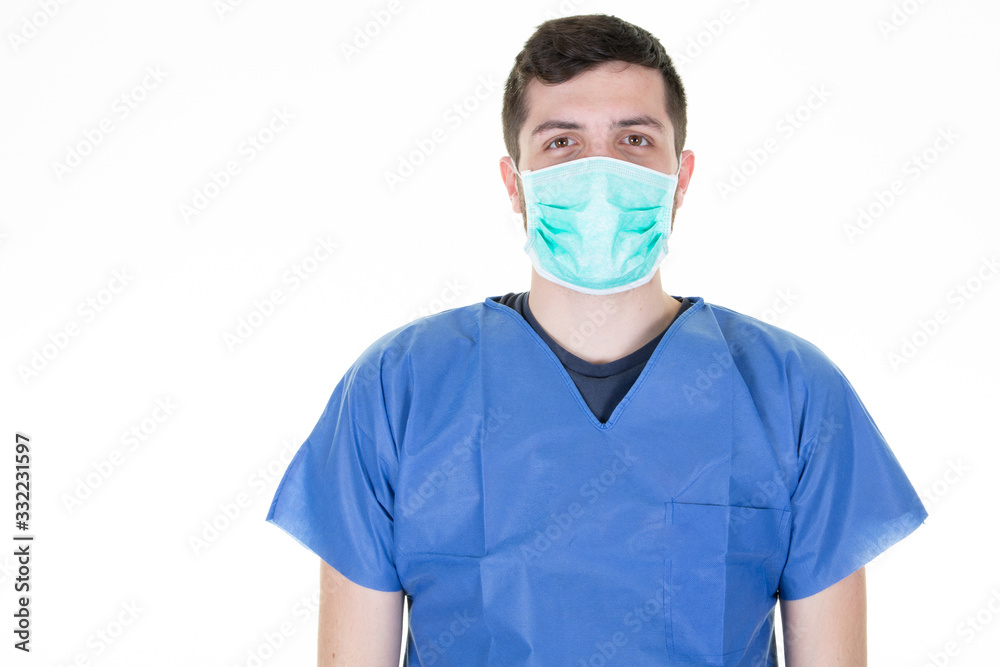 man doctor in blue medical protective mask clothing to health protection from Coronavirus COVID-19 virus epidemic infectious diseases man doctor in blue medical protective mask clothing to health protection from Coronavirus COVID-19 virus epidemic infectious diseases