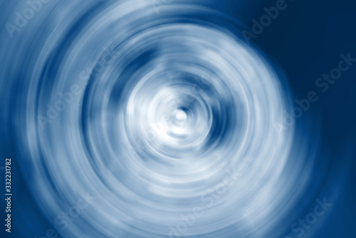 Abstract white twirl pattern on a blue background