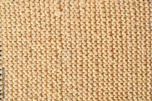 Knitted texture in beige macro with a handkerchief technique