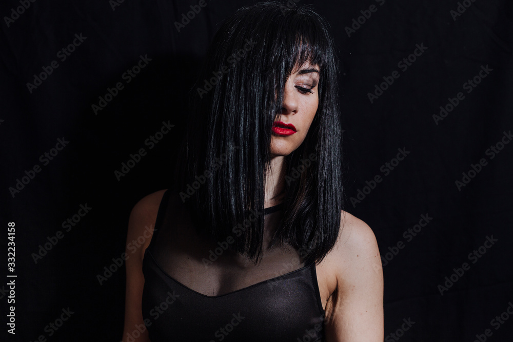 woman posing on black background