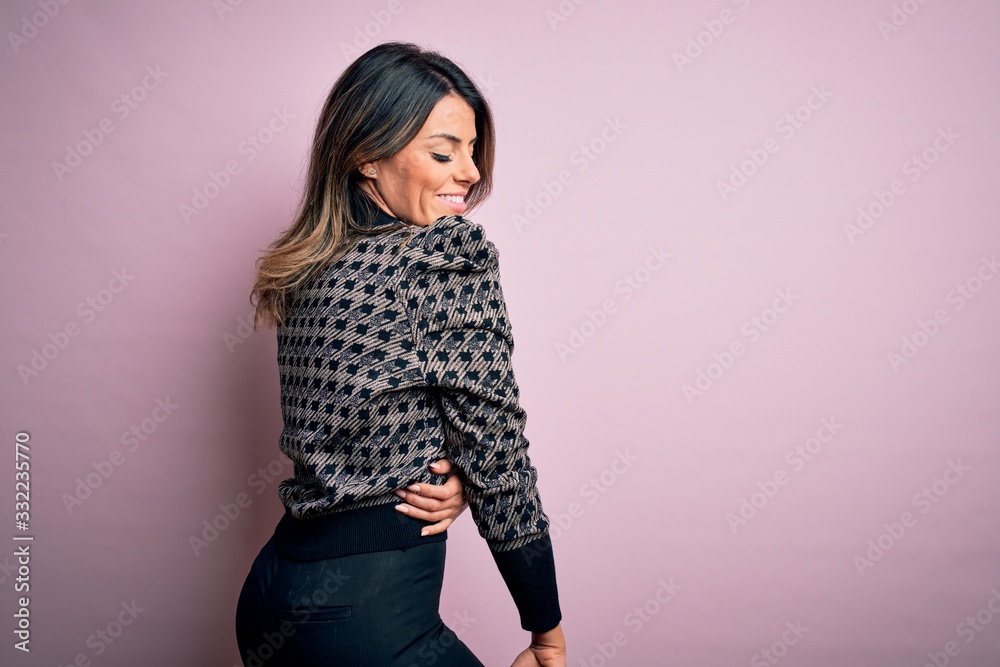 Young beautiful woman wearing fashion urban clothes, model wearing casual street style standing over pink background Young beautiful woman wearing fashion urban clothes, model wearing casual street style standing over pink background