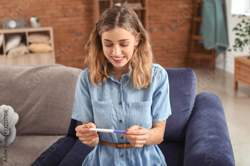 Happy young woman with preg...