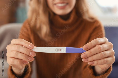 Happy young woman with preg...