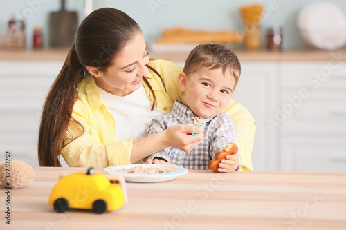 Nanny feeding cute little b...