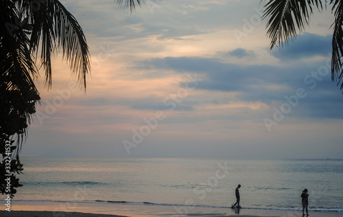 The couple enjoy a romantic sunset on the beach Series #2