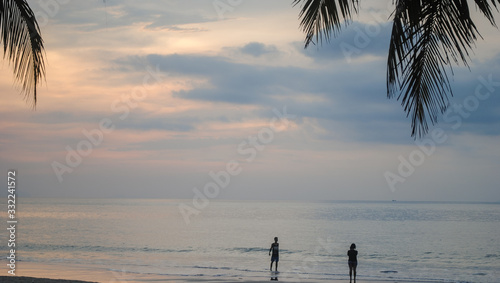 The couple enjoy a romantic sunset on the beach Series #3