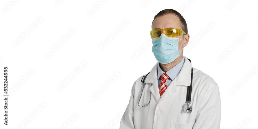 A doctor looks at the camera. Isolated on a white background.