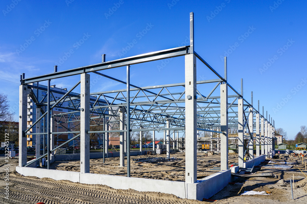 The steel frame of a building under construction The steel frame of a building under construction