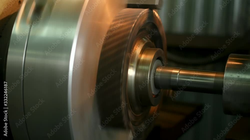 Internal grinding of a cylindrical part with an abrasive wheel on a machine, sparks fly in different directions. Metal machining. Internal grinding of a cylindrical part with an abrasive wheel on a machine, sparks fly in different directions. Metal machining.