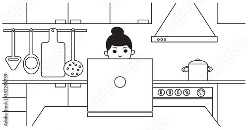 young woman working at home in the kitchen with a laptop