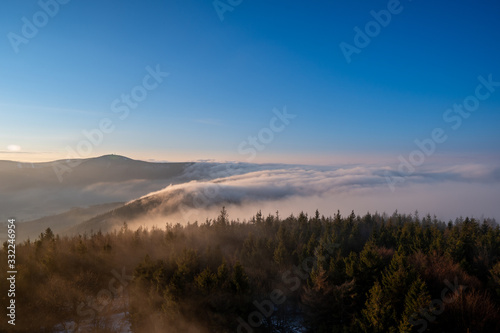 Sunrise in mountains in spring with fog and beautiful forest, Czech Beskydy © Martin