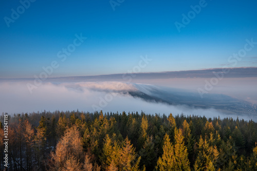 Beautifully lit fog at sunrise in the mountains  Czech Beskydy