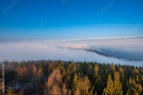 Beautifully lit fog at sunrise in the mountains, Czech Beskydy