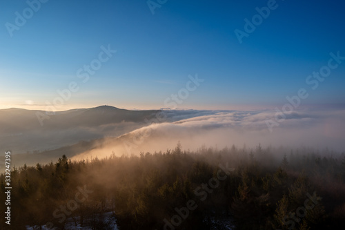 Beautifully lit fog at sunrise in the mountains, Czech Beskydy