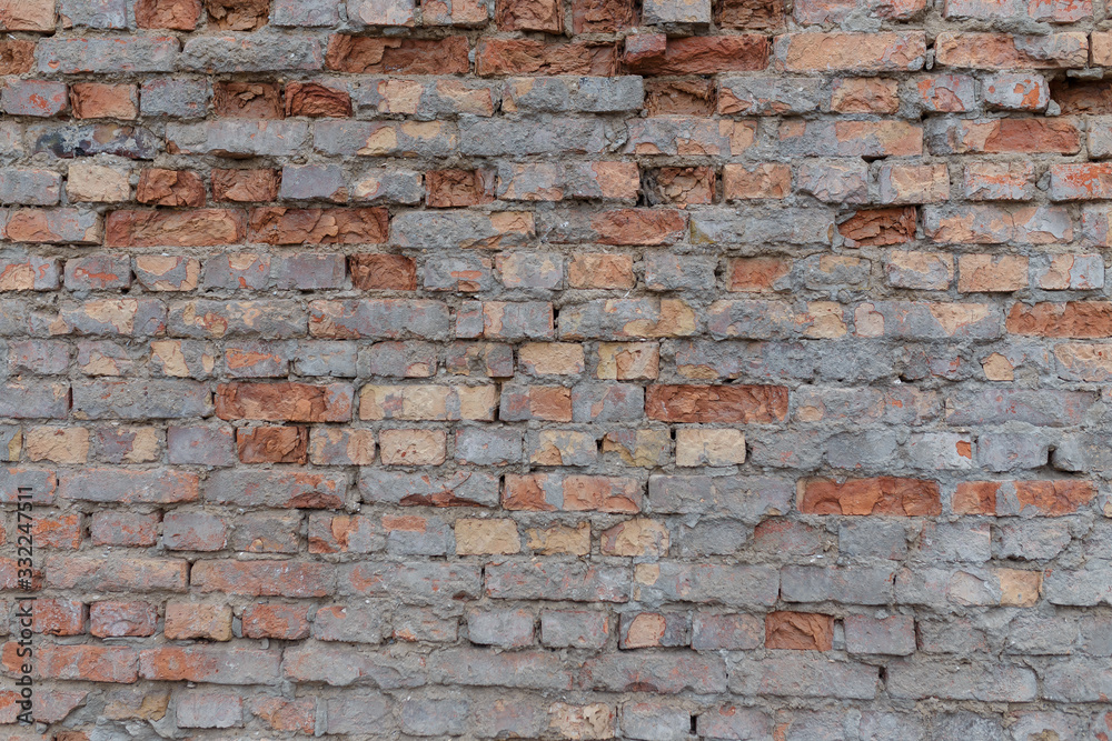 Obraz premium Dirty uneven brickwall texture background or backdrop with stains and cement smears