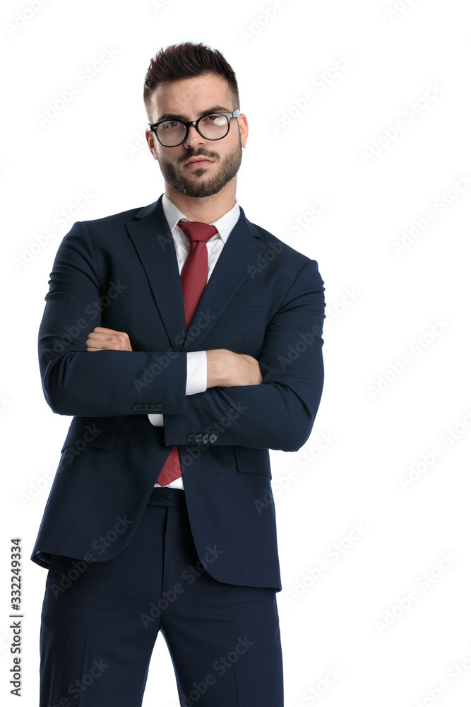 businessman standing with arms crossed and striking a pose businessman standing with arms crossed and striking a pose