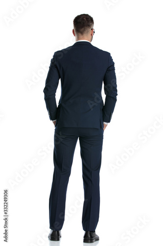 businessman standing with hands in pocket and looking ahead © Viorel Sima
