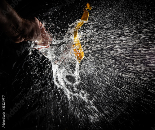 Exploding waterballoon against a black background photo