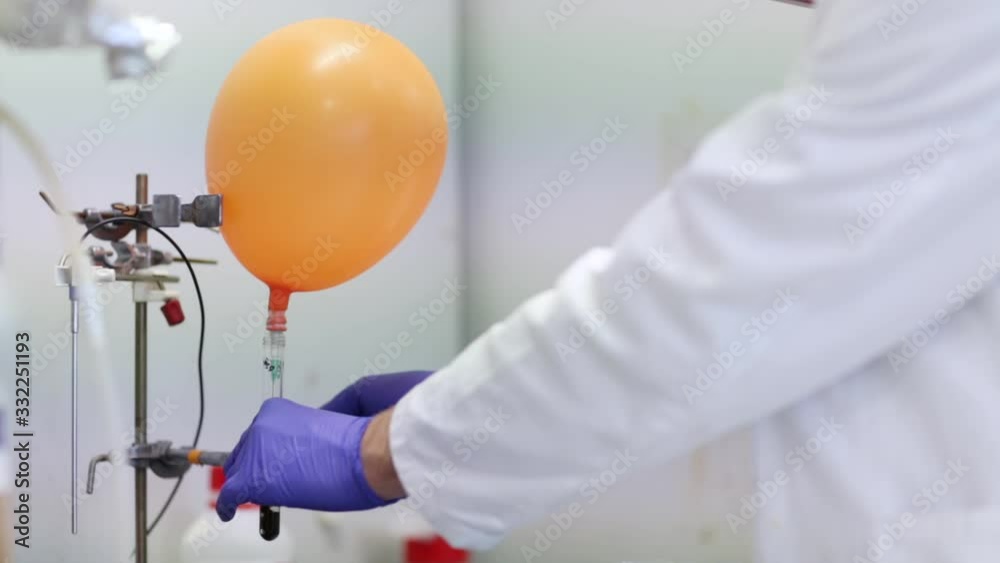 Researcher carrying out scientific experiment in a hi-tech chemistry laboratory. Analyzing results, sampling, pipet, mixing liquids in flasks. Researcher carrying out scientific experiment in a hi-tech chemistry laboratory. Analyzing results, sampling, pipet, mixing liquids in flasks.