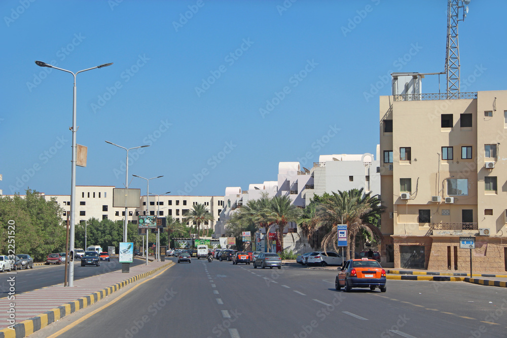 Transportation and traffic on highway in Hurghada city. City with street cars Transportation and traffic on highway in Hurghada city. City with street cars