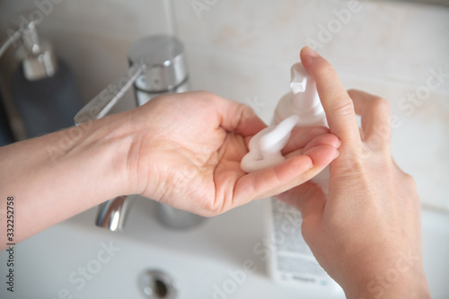 hand washing  female hands squeeze foam
