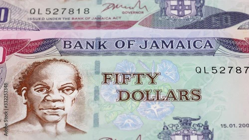 Wallpaper Mural Jamaica dollar notes tracking. Jamaican currency. Slider shot. Low angle, 4K Torontodigital.ca