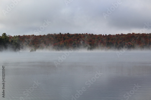 Mist on the lake in the fall