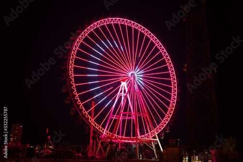 Ferris wheel at night with Turkish flag In Antalya Turkey