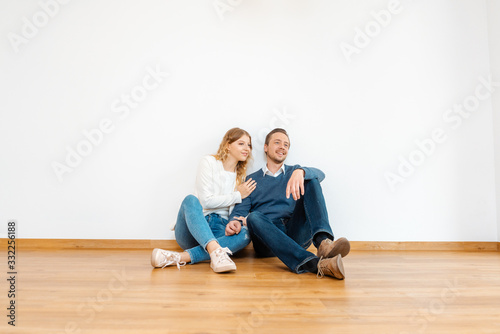 Couple dreaming about their future in the new apartment