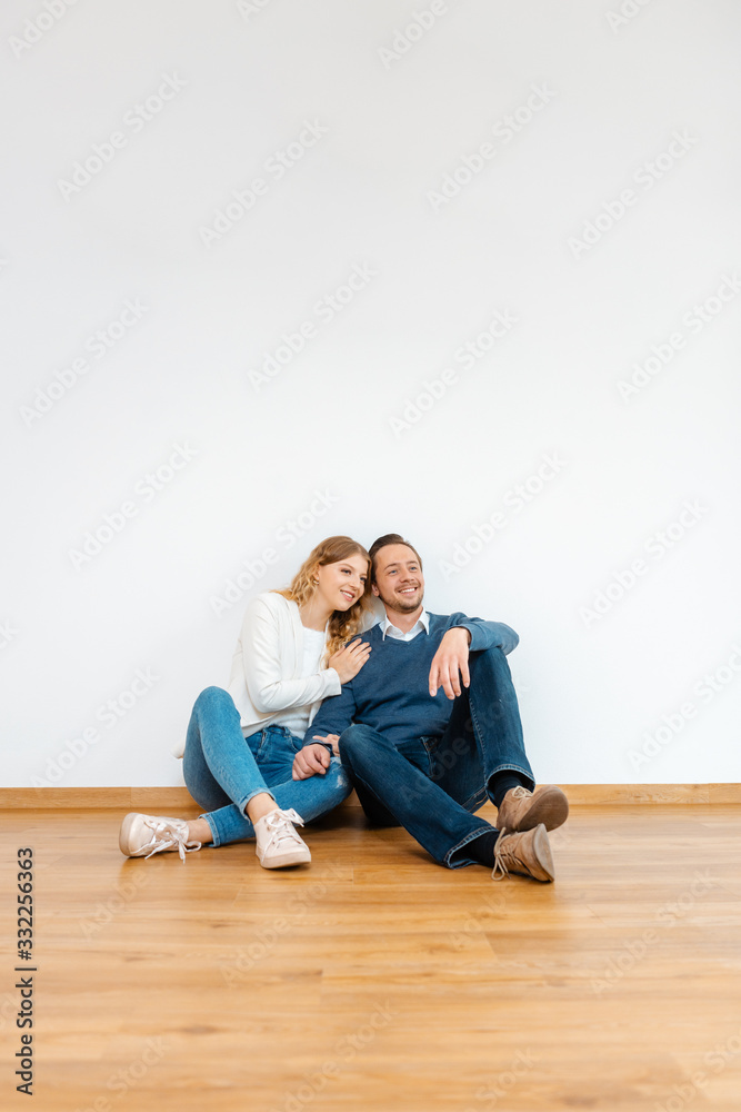 Couple dreaming about their future in the new apartment Couple dreaming about their future in the new apartment